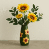 green vase with flower